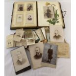 A leather bound Victorian photograph album together with a quantity of Victorian cabinet cards.