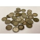 A small collection of 10 silver three pence coins and 22 half silver three pence coins.