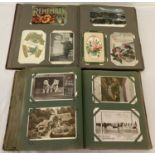 2 vintage postcards albums containing a quantity of assorted vintage cards.