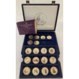 A collection of 18 cased "The Crowning Moments Of Queen Elizabeth II" 24 carat gold plated Crowns.