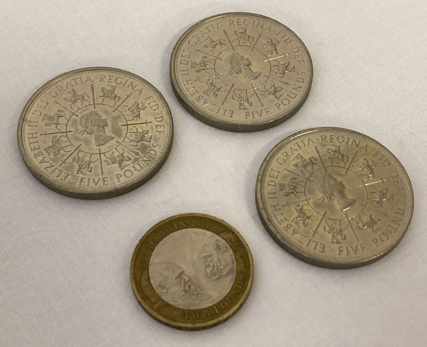 3 x 1993 Bitish £5 coins together with a 2009 "Darwin" £2 coin.