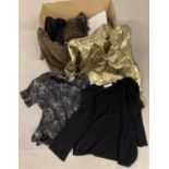 A box of vintage 1980's ladies clothes in metallic tones, many with original labels and packaging.