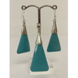 A triangular shaped turquoise style pendant, with 925 silver mount & bale.