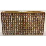 2 wooden wall hanging racks containing 200 assorted ceramic advertising thimbles.