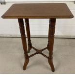 A Victorian Mahogany side/hall table with turned decoration to legs and stretchers and shaped feet.