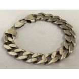 A heavy weight silver curb chain bracelet.
