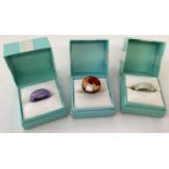 3 boxed rings. A lavender jade band and a pale green jade band.