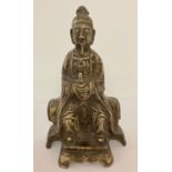 A Chinese white metal figurine of an Oriental scholar.