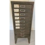 A vintage metal storage cabinet with 10 slim drawers. With original green paintwork.