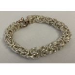 A decorative byzantine style chain bracelet with large spring clasp.