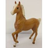 A Royal Doulton Palomino (Prancing Arab type) ceramic figurine, model #DA49.