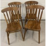 A set of 4 oak farmhouse style kitchen chairs.
