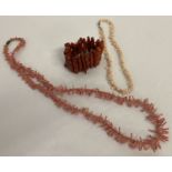 3 items of coral beaded jewellery.