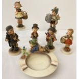 6 West German Goebel ceramic Hummel figurines together with an ashtray.