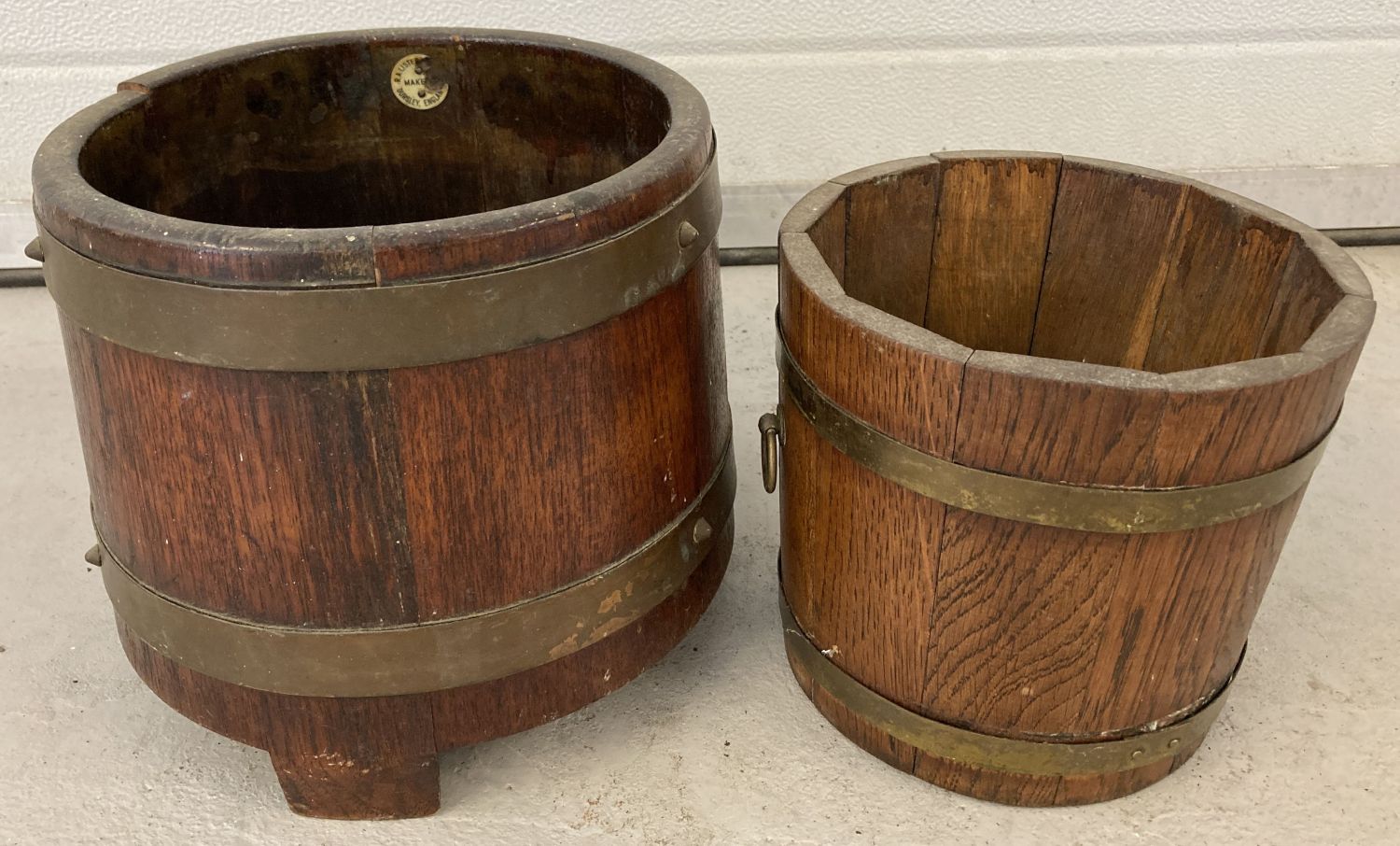 A vintage brass banded Coopered barrel plant pot holder on 3 feet by R.A Lister & Co, Ltd.