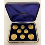 A vintage set of Barclays Woollen Co Ltd, London, gold tone buttons, in original box.
