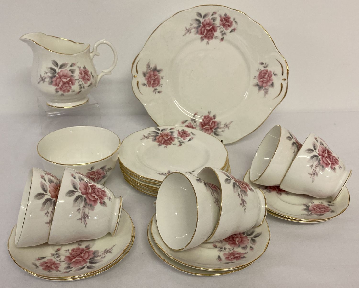 A vintage Duchess bone china, 6 setting tea set with rose detail.