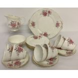 A vintage Duchess bone china, 6 setting tea set with rose detail.