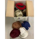 A box of assorted vintage hats in varying styles and sizes.