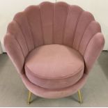 A new shell shaped retro style boudoir chair with dusky pink velvet upholstery.