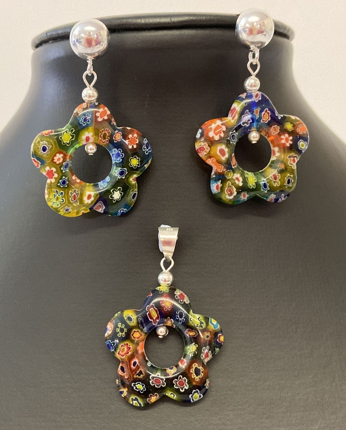 A Millefiori glass flower shaped pendant and matching earrings sets.