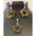 A Millefiori glass flower shaped pendant and matching earrings sets.