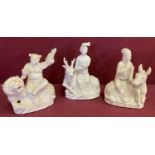 3 Chinese ceramic blanc de chine figurines depicting figures sitting atop animals.