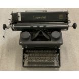 A vintage black metal typewriter by Imperial.