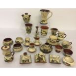 A box of assorted vintage motto ware Torquay pottery items to include Scandy and cockerel patterns.