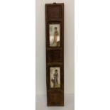 A slim wooden panel with painted ceramic plates featuring figural detail.