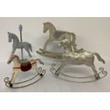 4 ornamental small rocking and carousel horses in varying styles and sizes.