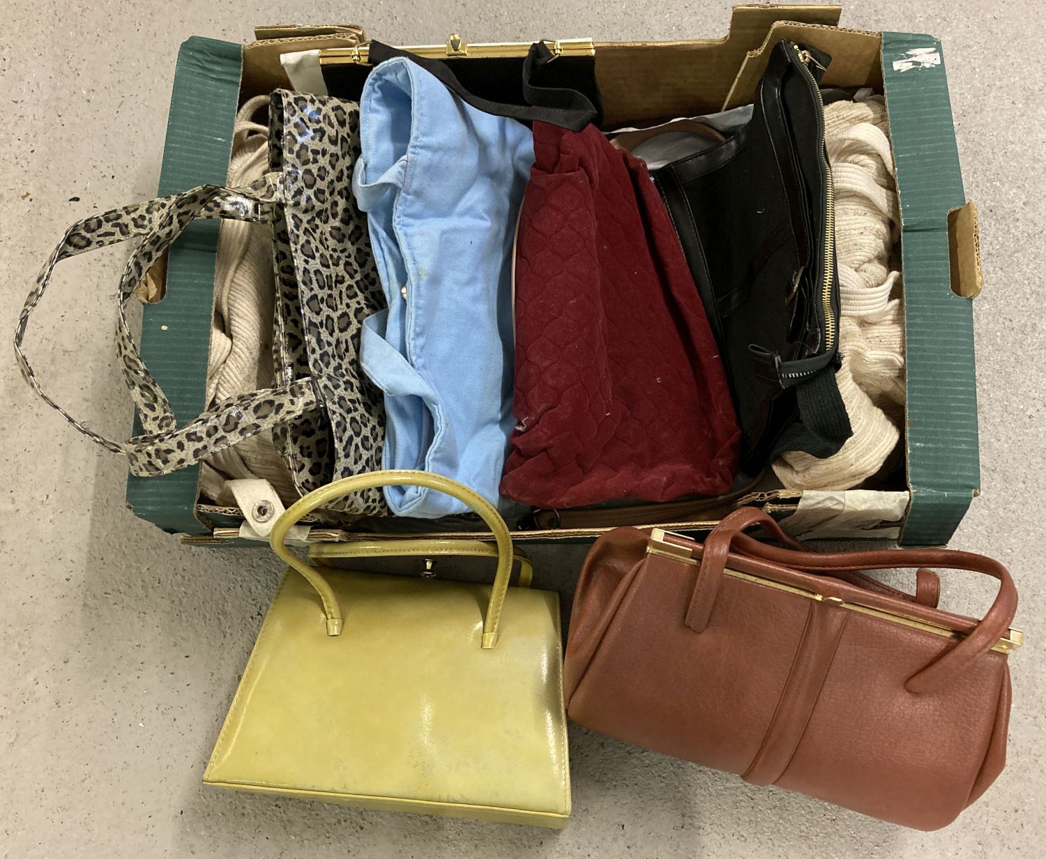 A box of assorted vintage larger bags and kelly style handbags.