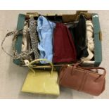 A box of assorted vintage larger bags and kelly style handbags.