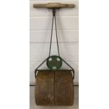 A vintage cast iron "Ironcrete" garden roller by Scoffin & Willmott Ltd, London.