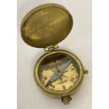 A vintage handheld brass cased compass by T. Cooke, London.
