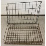 A vintage metal hay rack and metal bakers bread tray.