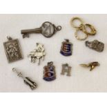 10 vintage silver and white metal charms.