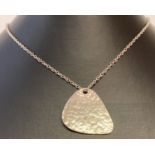 A contemporary design silver pendant with hammered effect detail on a 18" fine belcher chain.