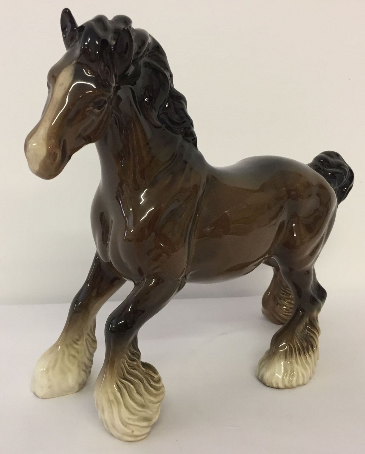 A Beswick ceramic Cantering Shire horse, in brown gloss finish.