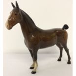 A Beswick ceramic "Hackney" horse in brown gloss finish, model #1361.