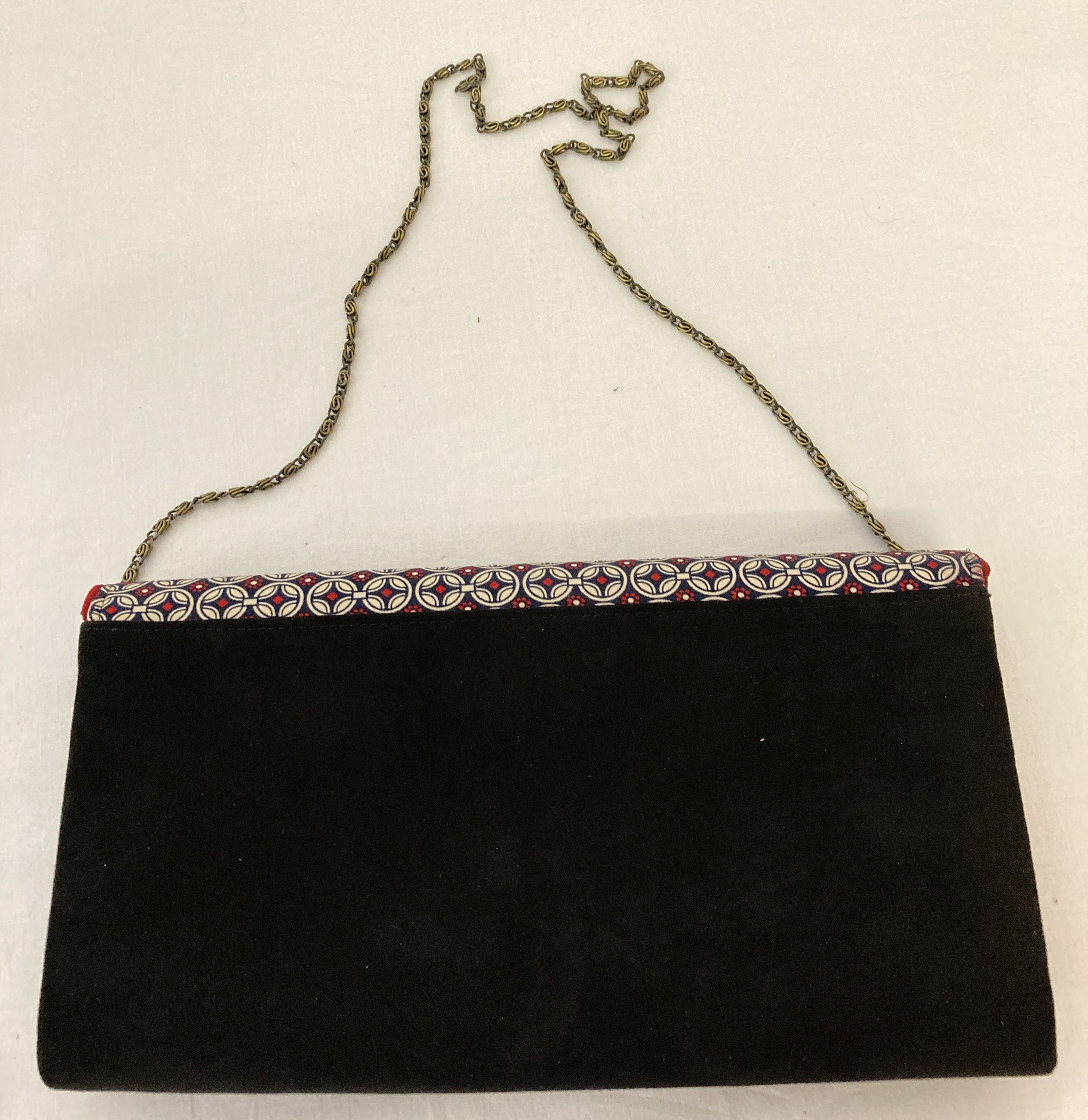 A Ruby Shoo faux suede clutch/shoulder bag in red, black and geometric print. - Image 5 of 5