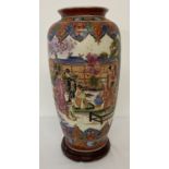 An oriental design ceramic vase depicting scenes of oriental ladies relaxing in a garden.