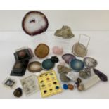 A collection of assorted gemstones and minerals to include slices and cased polished stones.