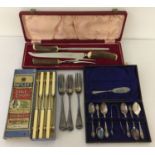 A collection of vintage boxed and unboxed cutlery.