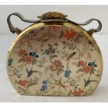 A vintage 1950's half moon minaudiere evening vanity bag with exotic bird and floral decoration.