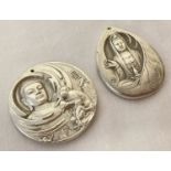 2 Chinese white metal, double sided pendants depicting Oriental Deities.
