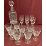 A heavy cut crystal square shaped decanter together with 2 sets of glasses.