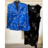 A satin oriental Tangzhuang reversible jacket together with a black velvet oriental style dress .