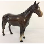 A Beswick ceramic Huntsman's Horse, model #1484, in brown gloss finish.
