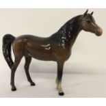 A Beswick ceramic Arab "Xayal" horse figurine, in brown gloss colourway. Model #1265.